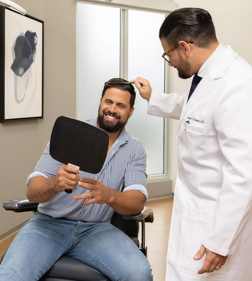 Doctor meeting with patient for Hair Transplant Consultation