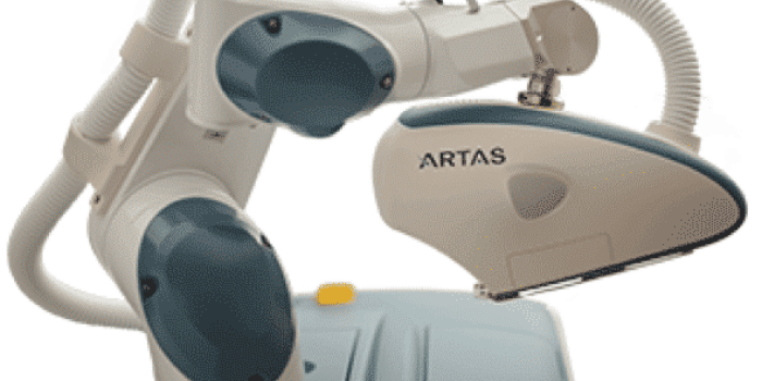 Artas robotic hair restoration system showcasing its precision robotic arm and advanced technology. This image highlights the ergonomic design and functionality of the device used for minimally invasive hair transplant procedures. The Artas system is designed to enhance accuracy and efficiency in hair restoration, making it a popular choice for patients seeking effective solutions for hair loss. Ideal for clinics and professionals in the cosmetic and medical fields, this image emphasizes the innovative approach to hair restoration technology.
